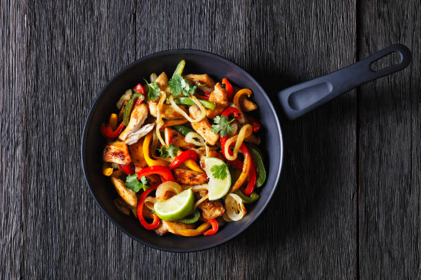 istock chicken fajitas with bell peppers, onion, spices 1484061412