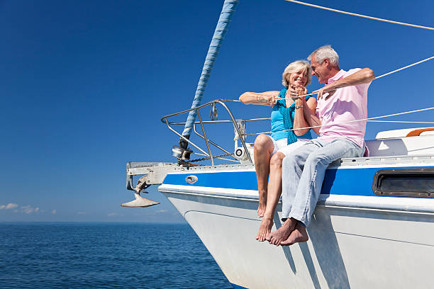 istock Happy Senior Couple Sitting On a Sail Boat 148406909