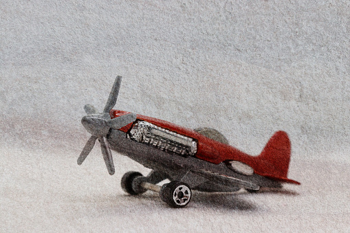 Toy plane on neutral background