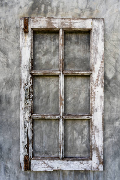 Old wooden frame from a window on a plastered wall, close-up
