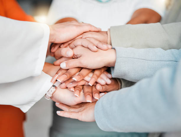 istock Team, hands together and collaboration in trust or unity for coordination or corporate goals at the office. Hand of group in teamwork celebration for partnership, agreement or community support 1484079215