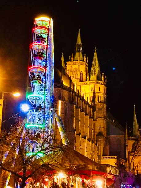 istock Luminous ferris wheel with church in the background 1484083343