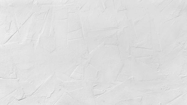 istock Texture of white plaster on a concrete wall handmade. Construction, interior design. 1484087755
