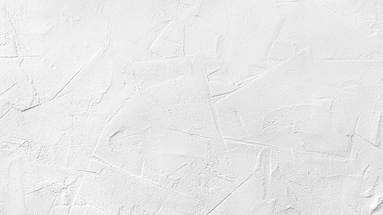 Texture of white plaster on a concrete wall handmade. Construction, interior design.