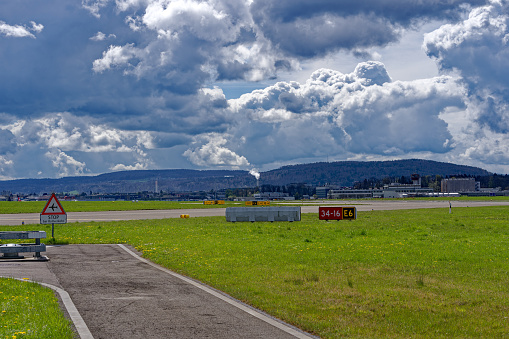 Scenic view of Swiss Airport Zürich Kloten with signs on a sunny spring day. Photo taken April 14th, 2023, Kloten, Canton Zurich, Switzerland.
