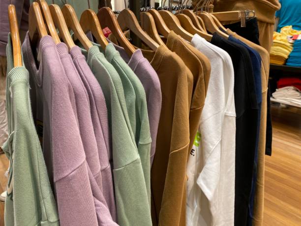 istock Clothes hang on a shelf in a designer clothes store. 1484093297