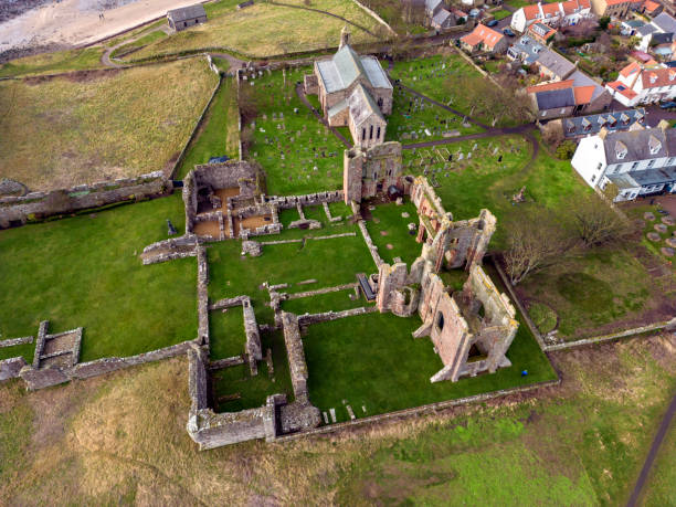 Lindisfarne Priory - Northumberland - England Aerial view of the medieval ruins of Lindisfarne Priory on Holy Island off the coast of Northumberland in northeast England. lindisfarne monastery stock pictures, royalty-free photos & images