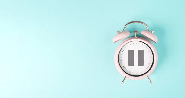 istock Alarm clock with pause sign, take a break, menopause concept, hormone replacement therapy 1484095868
