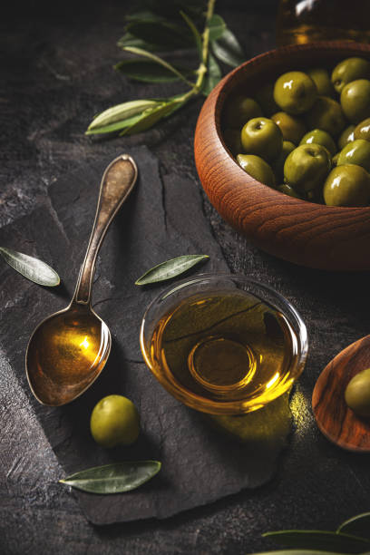 istock Green olives with olive oil 1484098114