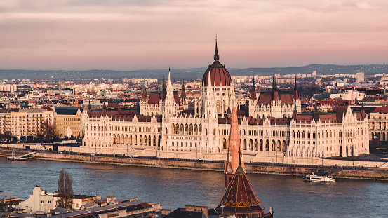 Budapest Hungary Twilight Panorama from above of the Hungarian Parliament Building. Sunset Twilight Panorama, high angle view towards the Parliament Building also known as the Parliament of Budapest on the Riverside of the Danube River. Hungarian Parliament Building on the Pest City Side of Budapest. Budapest, Hungary, Eastern Europe