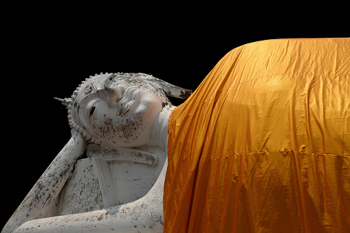 Sleeping Buddha statue at the temple  in Ayutthaya, Thailand  isolated on black background