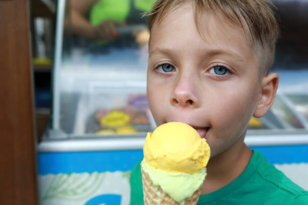 istock Child eating ice cream outdoor 1484101584