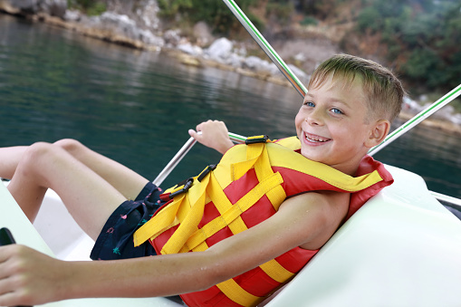 Child relaxing on catamaran on Black Sea