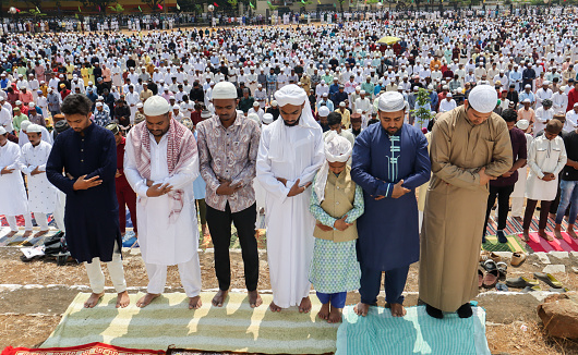 Islam devotees in their Arabic costume offering  the Salah prayers to the Allah during the Ramadan festival in Mysore, India.