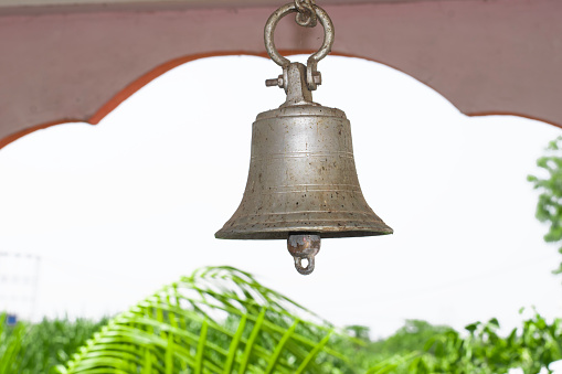 Bronze bell in India temple with blur background, Temple brass bell hanging