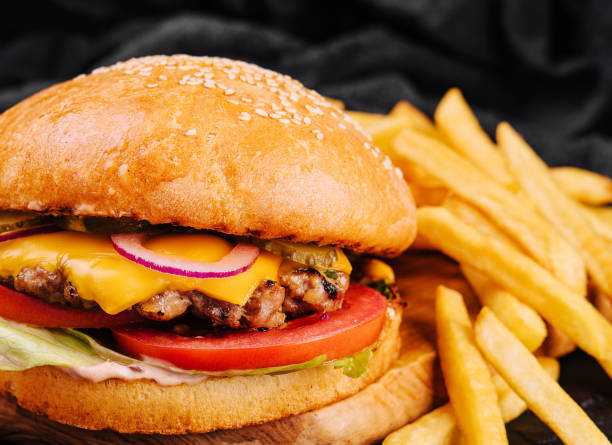 istock Burger, hamburger with french fries cutting board 1484103858