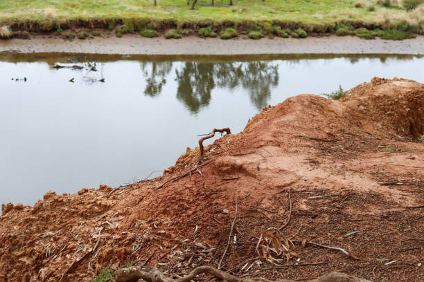 istock arid red dirt river bank overlooking water 1484106219