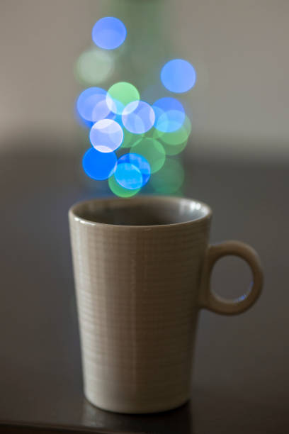 bubbly lonely mug of colored circles on gray metal table