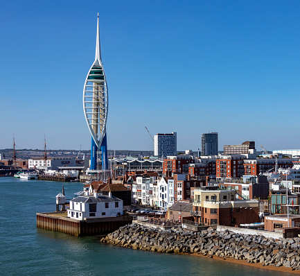 The harbor area and Spinnaker Tower in the city of Portsmouth on the south coast of England in the United Kingdom.