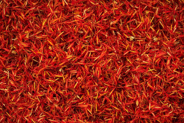 Safflower dry red flowers Safflower (Carthamus tinctorius) also known as bastard saffron dry red flowers heap top view substitute for saffron stock pictures, royalty-free photos & images