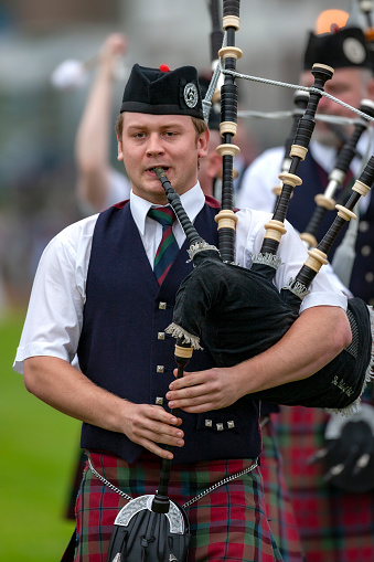 A Scotsman wearing a kilt, facing the hills of Perthshire.