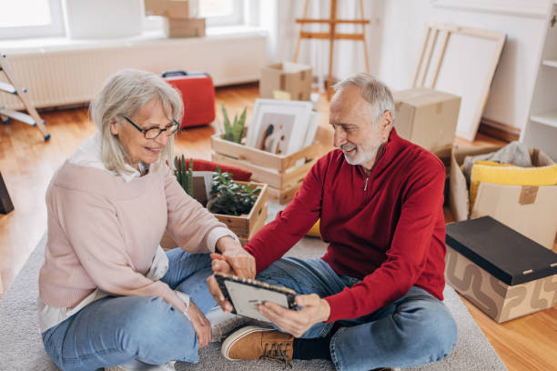 istock Senior couple unpacking in new apartment 1484119665