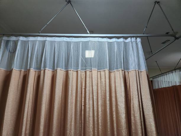 istock Dividing curtain between hospital patients 1484120323