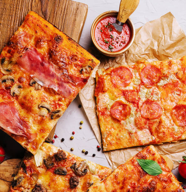 istock Tasty pizza on the wooden background 1484122046