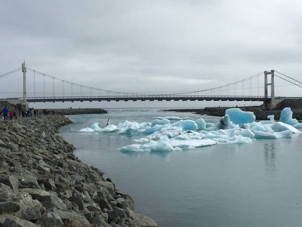 istock Ice blocks passing under a bridge, on the river, in Jokulsarlon 1484123811