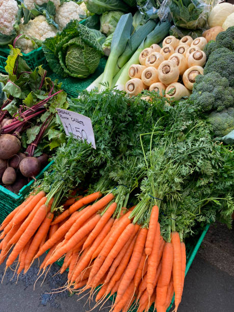 istock Vegetables for sale on a market stall. 1484123893