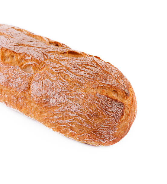 istock Black bread loaf closeup on white background 1484124457