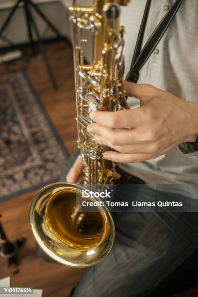 Hands Of A Musician Playing The Saxophone In A Rehearsal Room Stock Photo - Download Image Now