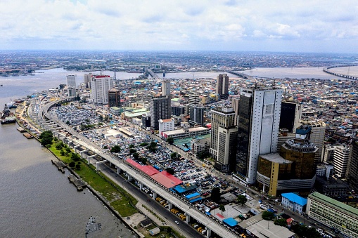 A drone shot of Lagos Marina with the three bridges in the background