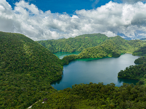 Lake in the mountains among tropical vegetation. Balinsasayao Twin Lakes Natural Park. Negros, Philippines