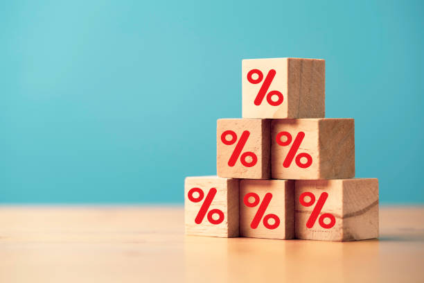 istock Red percentage sign symbol print screen on wooden cube block stacking for increasing interest and dividend form investment concept. 1484127290