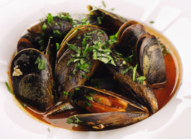 istock Mussels close up on white plate 1484129586