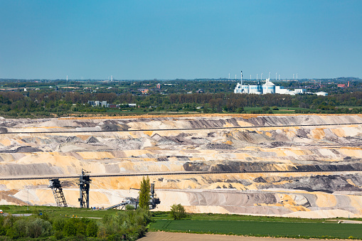 West German industry landscape with a lignite pit mine in front of a sugar factory