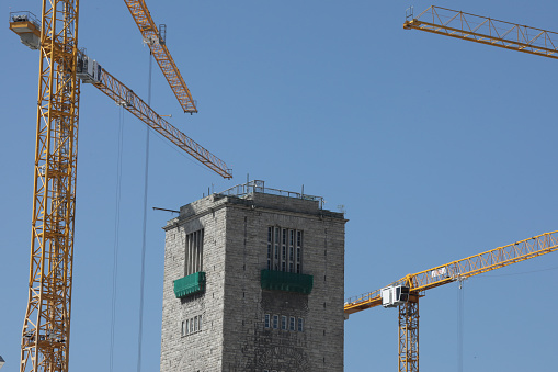 stuttgart, bw, germany, april 21, 2023, the tower of the main station in stuttgart with construction cranes