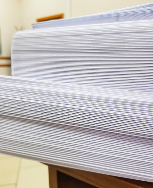 istock A stack of blank paper, book blocks prepared for binding in a printing house 1484134850