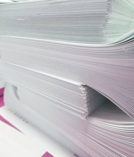 istock A stack of blank paper, book blocks prepared for binding in a printing house 1484134859