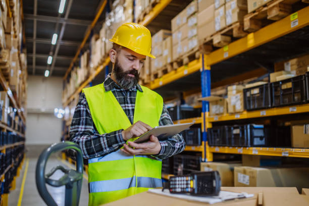 istock Warehouse worker stocking goods in a warehouse. 1484138163