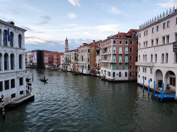 canal with boat in venice stock photo