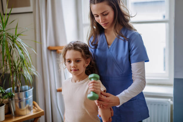 istock Little girl doing exercise with a nurse. 1484138341