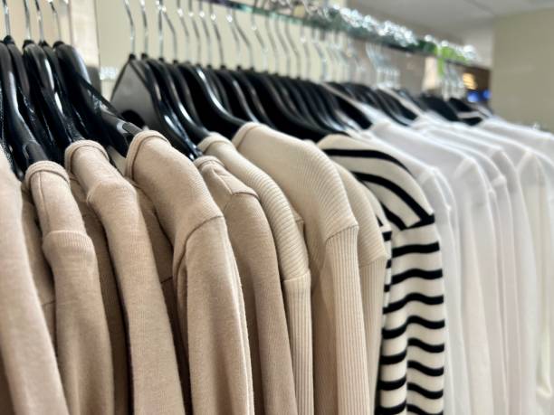 istock hanged garments and shirts on racks in a store 1484141908