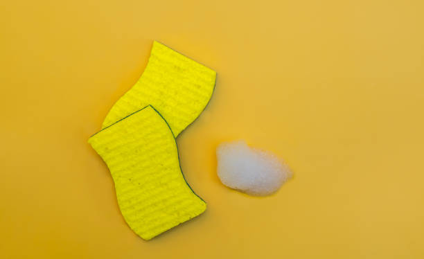 istock Sponges for washing dishes on a yellow background 1484142209