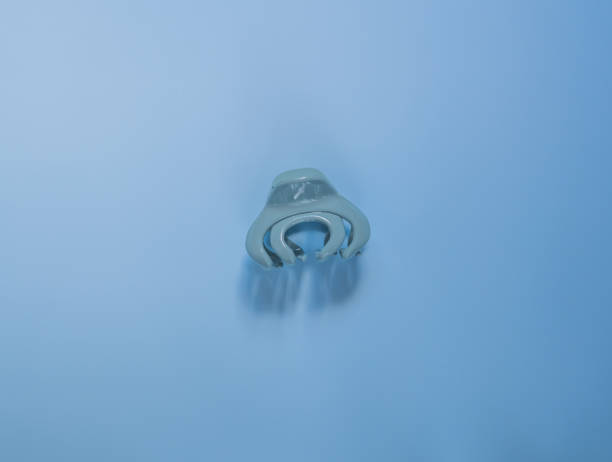 istock Blue hair clip on a blue background 1484142504
