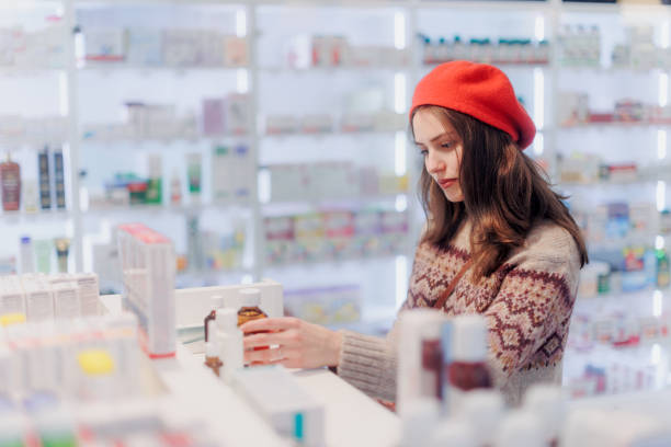 istock Young woman choosing a medication in pharmacy store. 1484142653
