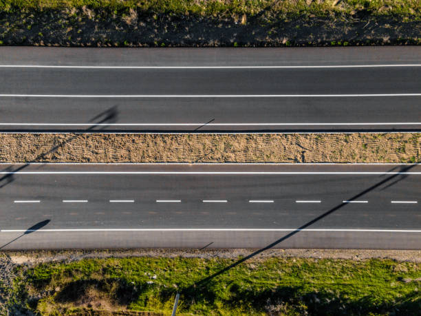 istock Asphalt road shoot directly above 1484142880