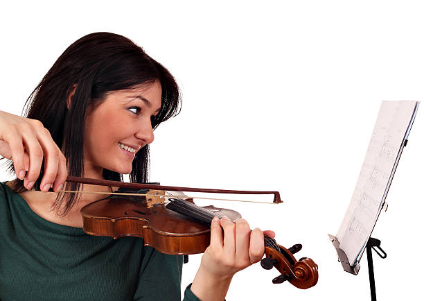 istock beautiful girl violinist 148414560