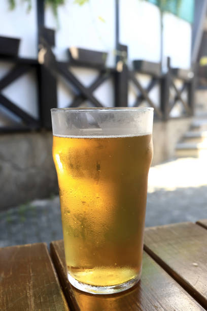 istock Pint of lager on wooden table 1484147196